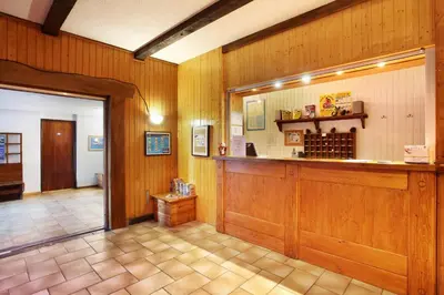 a large room with a counter in at Résidence Odalys Le Front de Neige in Les Carroz d'Araches