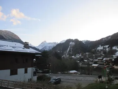 a view of a town with mountains in the background at appartement 4 personnes Armancette in Les Contamines-Montjoie