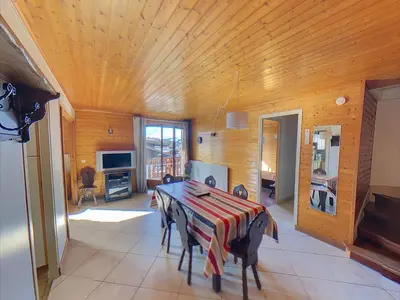 a dining room with a table in a room at Appartement 6 Pers centre station Carroz (ARB31) in Les Carroz d'Araches