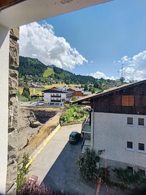 a view of a city from a balcony of a building at Appartement 6 Pers centre station Carroz (ARB31) in Les Carroz d'Araches