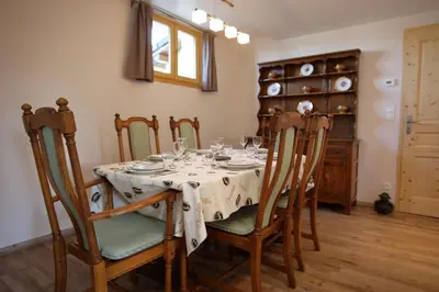 a dining room with a table with glasses on it at Chalet Haut Standing à proximité du centre (CH228) in Les Carroz d'Araches