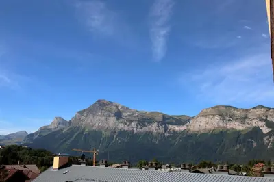 a view of a mountain range from a city at 2 Pièces 6 Pers centre station (GV211) in Les Carroz d'Araches
