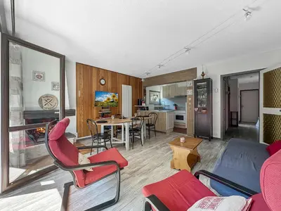 a living room with a couch and a table at 3 Pièces 6/8 Pers proche centre Carroz (MU0001) in Les Carroz d'Araches