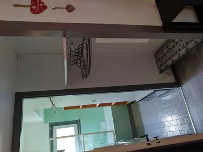 a large mirror in a bathroom with a sink and a mirror at 3 Pièces 6/8 Pers proche centre Carroz (MU0001) in Les Carroz d'Araches