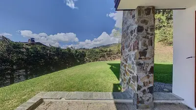 a view of a field from the door of a house at 3 Pièces 6 Pers proche pistes (PN001) in Les Carroz d'Araches