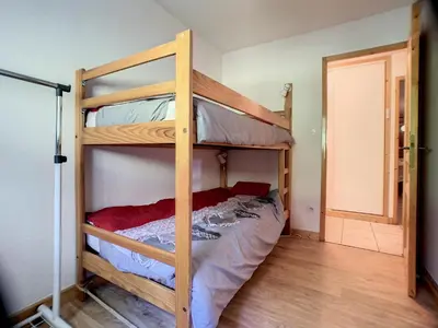 a bedroom with two bunk beds in a room at 3 Pièces 6 Pers proche pistes (PN001) in Les Carroz d'Araches