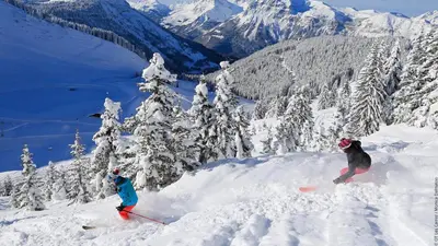 two people are skiing down a snow covered mountain at Duplex 6 Pers centre station Carroz (SA315) in Les Carroz d'Araches
