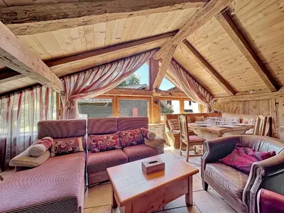 a living room with a couch and a table at - Duplex Haut Standing 6 pers (ZE101) in Les Carroz d'Araches