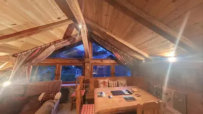 a dining room with a table in a tree house at - Duplex Haut Standing 6 pers (ZE101) in Les Carroz d'Araches