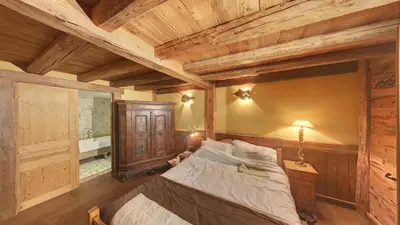 a bedroom with a bed and a wooden ceiling at - Duplex Haut Standing 6 pers (ZE101) in Les Carroz d'Araches