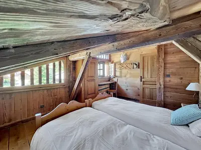 a bedroom with a bed in a log cabin at - Duplex Haut Standing 6 pers (ZE101) in Les Carroz d'Araches