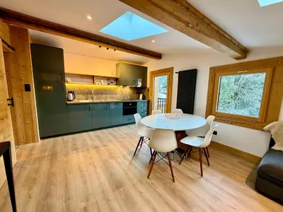 a kitchen and dining room with a table and chairs at The Castle, 10 Bedroom Chalet, Chamonix Centre in Chamonix-Mont-Blanc