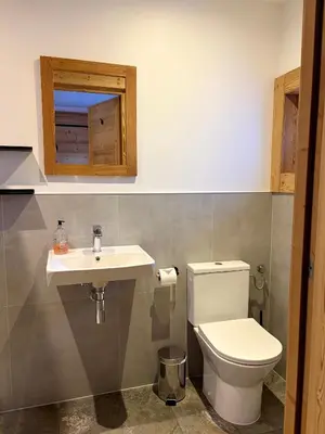 a bathroom with a toilet and a sink at The Castle, 10 Bedroom Chalet, Chamonix Centre in Chamonix-Mont-Blanc