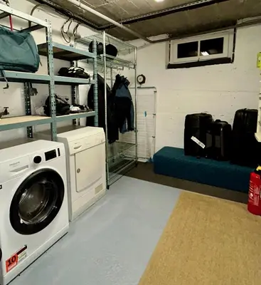 a laundry room with a washing machine in it at The Castle, 10 Bedroom Chalet, Chamonix Centre in Chamonix-Mont-Blanc