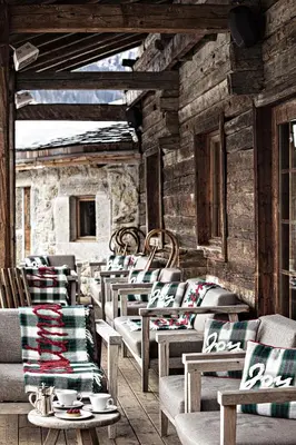 a row of chairs in a room with wooden walls at Les Fermes de Marie in Megève