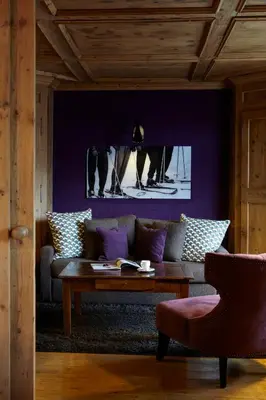 a living room with a couch and a table at Hotel Mont Blanc Megève in Megève