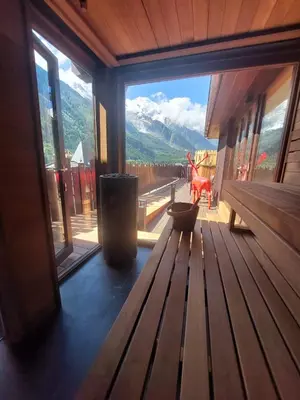 a pink bathroom with a shower with a purple ceiling at Park Hotel Suisse & Spa in Chamonix-Mont-Blanc