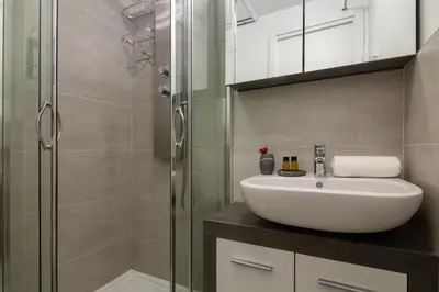 a bathroom with a sink and a shower at Appartement Paccard 305 - Happy Rentals in Chamonix-Mont-Blanc
