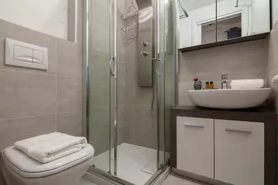 a bathroom with a shower and a toilet and a sink at Appartement Paccard 305 - Happy Rentals in Chamonix-Mont-Blanc