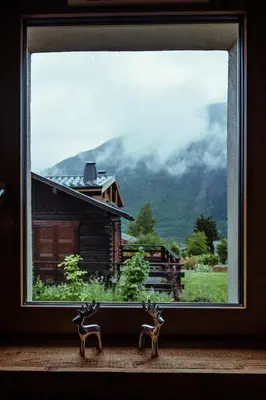 a window with a view of a mountain at Chalet du Rachet Chamonix Mont-Blanc in Les Houches