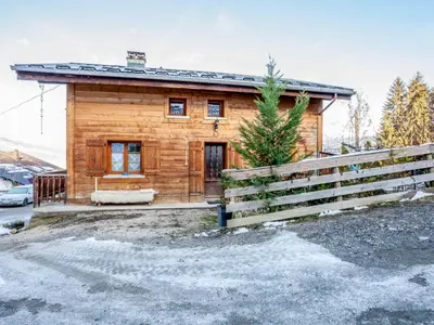 a log cabin with a fence in front of it at Apartment A la Claire Fontaine 1 by Interhome in Mémontel