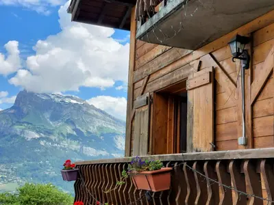 a window of a building with flowers on the balcony at Apartment A la Claire Fontaine 1 by Interhome in Mémontel