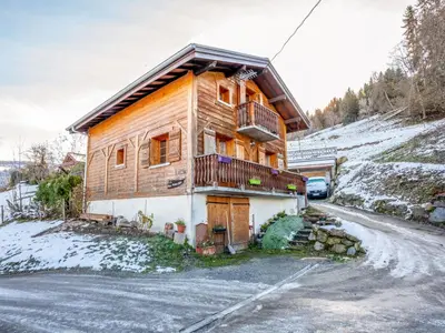 a wooden house on the side of a mountain at Apartment A la Claire Fontaine 2 by Interhome in Mémontel