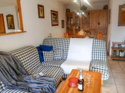 a living room with two couches and a bed at Apartment L'Espace Montagne-15 by Interhome in Chamonix-Mont-Blanc