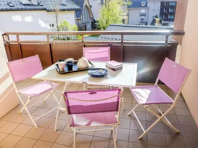 a table and chairs sitting on a balcony at Apartment L'Espace Montagne-15 by Interhome in Chamonix-Mont-Blanc