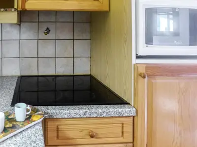a kitchen with a microwave and a counter top at Apartment L'Espace Montagne-15 by Interhome in Chamonix-Mont-Blanc