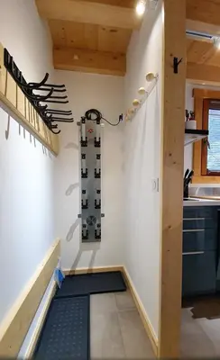 a kitchen with a stairway leading up to a kitchenasteryasteryasteryasteryastery at Le camp de base in Chamonix-Mont-Blanc