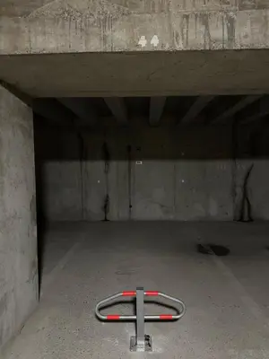 a hose is sitting inside of a garage at Studio 4 Pers (AM113) in Les Carroz d'Araches