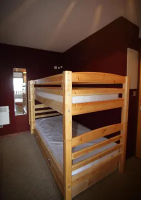 a wooden bunk bed in a room at AG005 - Studio coin montagne proche pistes in Les Carroz d'Araches