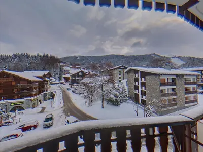 a view of a city in the snow from a balcony at CL349 - Studio 4 Pers centre des Carroz in Les Carroz d'Araches