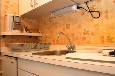 a kitchen with a sink and a counter top at CL349 - Studio 4 Pers centre des Carroz in Les Carroz d'Araches