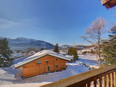 a wooden cabin with snow on the roof at CX116 - Duplex 6 pers Pied de pistes in Les Carroz d'Araches