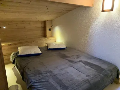a bedroom with a large bed in a room at CX116 - Duplex 6 pers Pied de pistes in Les Carroz d'Araches