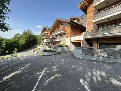 an empty street in front of a building at GCF211 appartement 6 pers pied de piste in Les Carroz d'Araches