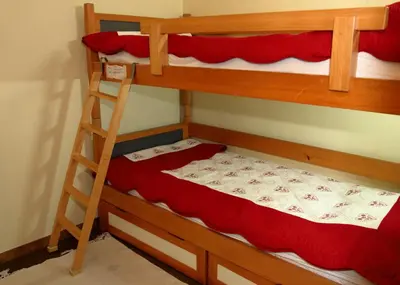 two bunk beds in a room with a ladder at GR007 - 2 Pièces 5/6 pers centre Carroz in Les Carroz d'Araches