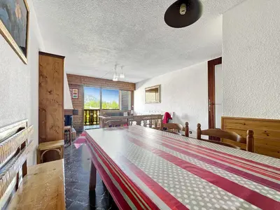 a dining room with a large table in the middle at GR007 - 2 Pièces 5/6 pers centre Carroz in Les Carroz d'Araches