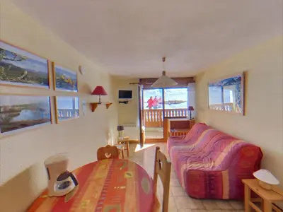 a living room with a couch and a table at MA002 2 Pièces 4 Pers centre Carroz in Les Carroz d'Araches