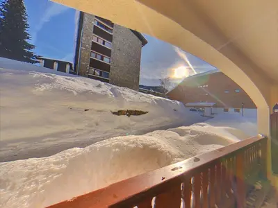 a pile of snow on a balcony with a building at MA002 2 Pièces 4 Pers centre Carroz in Les Carroz d'Araches
