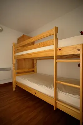 a couple of bunk beds in a room at MA002 2 Pièces 4 Pers centre Carroz in Les Carroz d'Araches