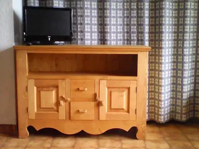 a wooden cabinet with a television on top of it at NAN01 - Studio 4 Pers Télécabine in Les Carroz d'Araches