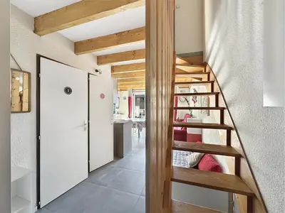 a wooden staircase in a small room with a room at OB222 - 2 pièces Mezzanine 6 pers pieds de pistes in Les Carroz d'Araches