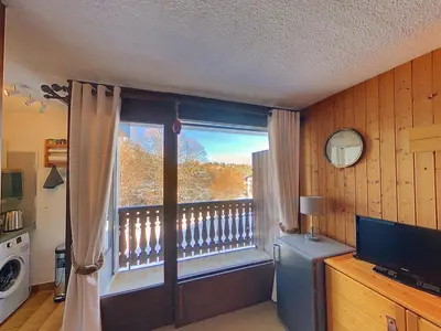 a room with a window with a view of a balcony at OEI20 - Studio 4/5 Pers proche centre Carroz in Les Carroz d'Araches