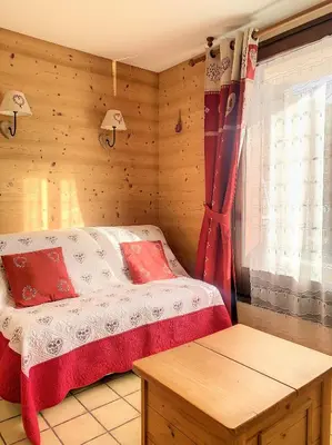 a bedroom with a bed and a window and a table at SH104 - Studio 4 pers centre des Carroz in Les Carroz d'Araches
