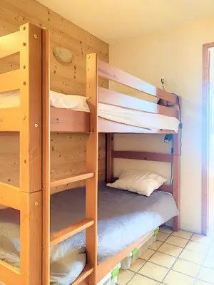 a bunk bed room with two bunk beds at SH104 - Studio 4 pers centre des Carroz in Les Carroz d'Araches