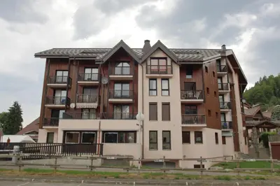 an apartment building in the middle of a street at SH104 - Studio 4 pers centre des Carroz in Les Carroz d'Araches