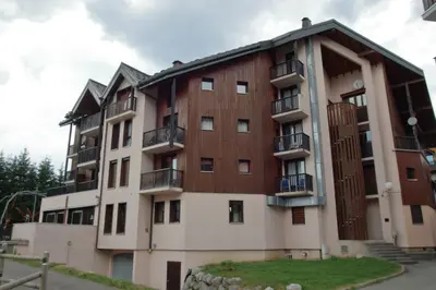 a large building with balconies on the side of it at SH104 - Studio 4 pers centre des Carroz in Les Carroz d'Araches